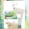 Deer Moss Club April mail kit on a pastel spring meadow background. A kraft envelope holds a typed "Hello friend" welcome letter, a spring meadow pastel postcard, and a tall bookmark of a deer among pale birch trunks. A deer stamp, bunny pair sticker, and pink cosmos sticker sit on top.